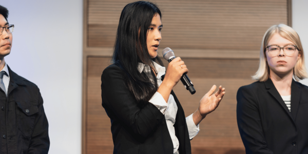 person speaking into a microphone