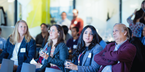 people sitting at a presentation