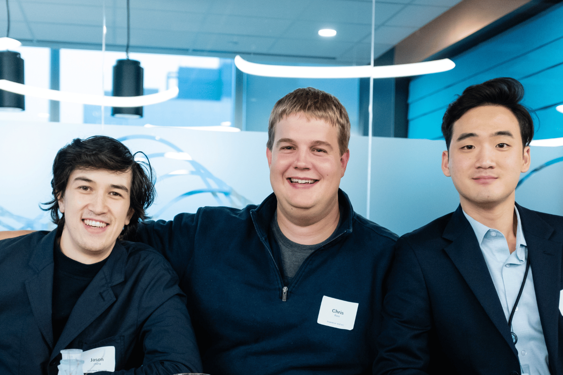 three people smiling