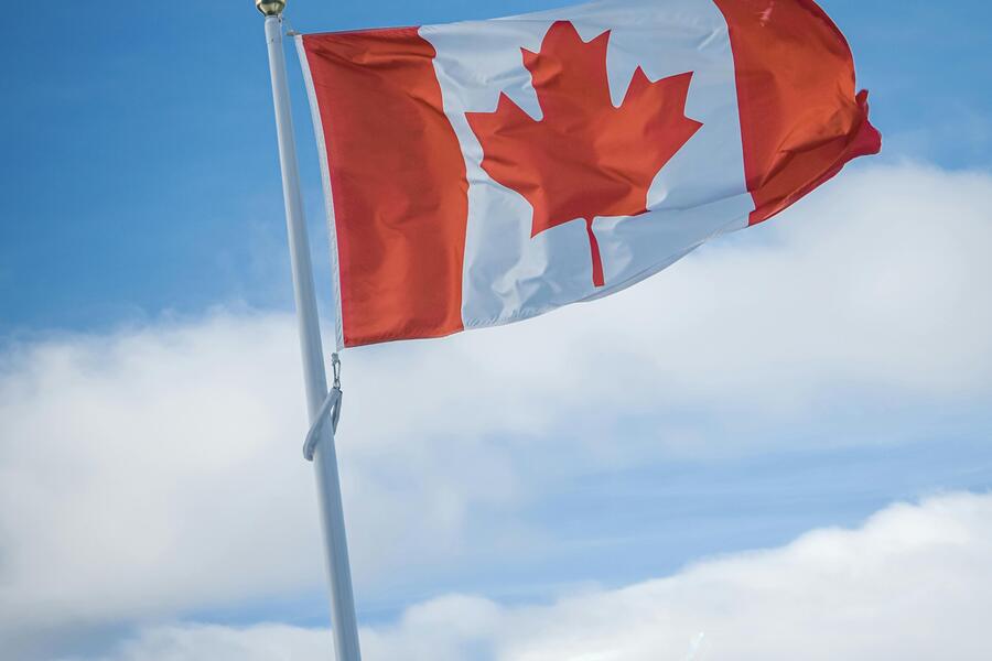 The Canadian flag flies at full mast