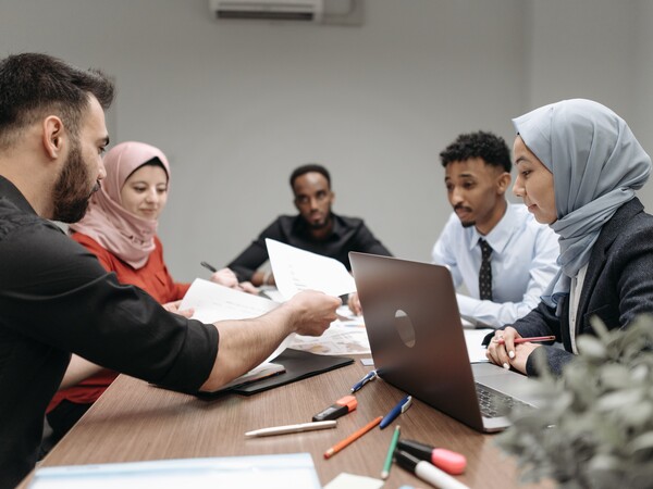people having a discussion at a table