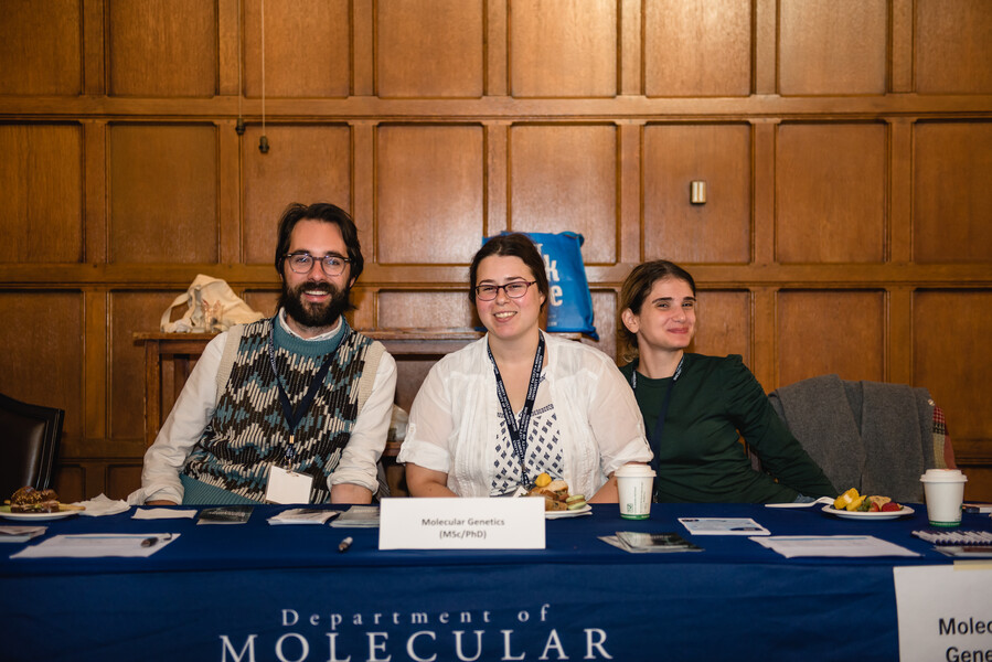 Volunteers sit together at a table