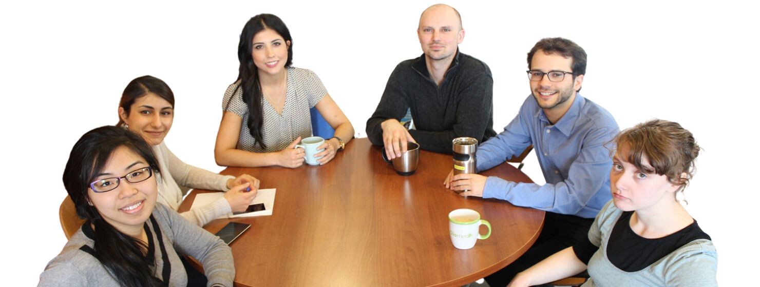 six students sit around a table